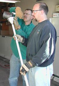 Pouring hot sand into pipe